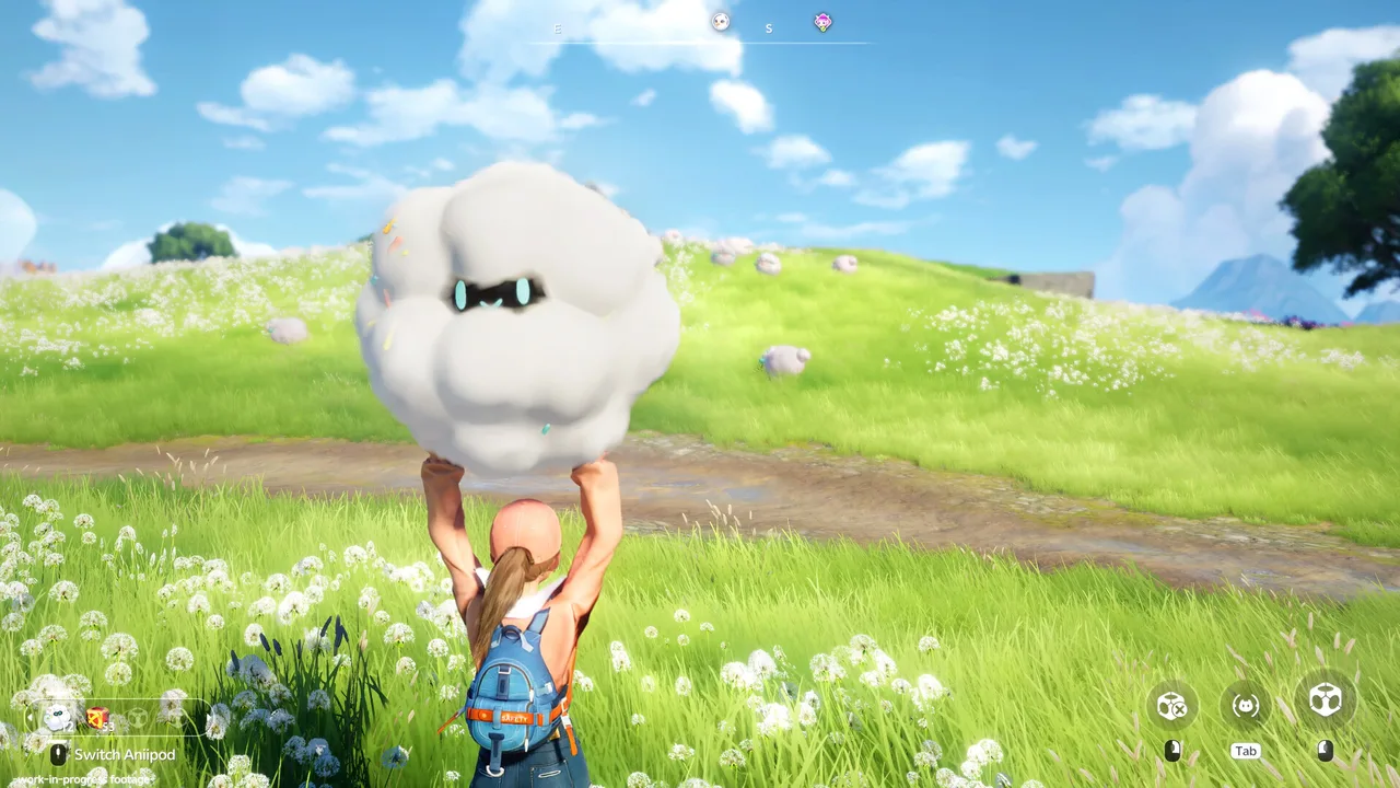 A player carrying a large fluffy cloud Aniimo across a flower meadow with grazing creatures nearby (official gameplay screenshot)